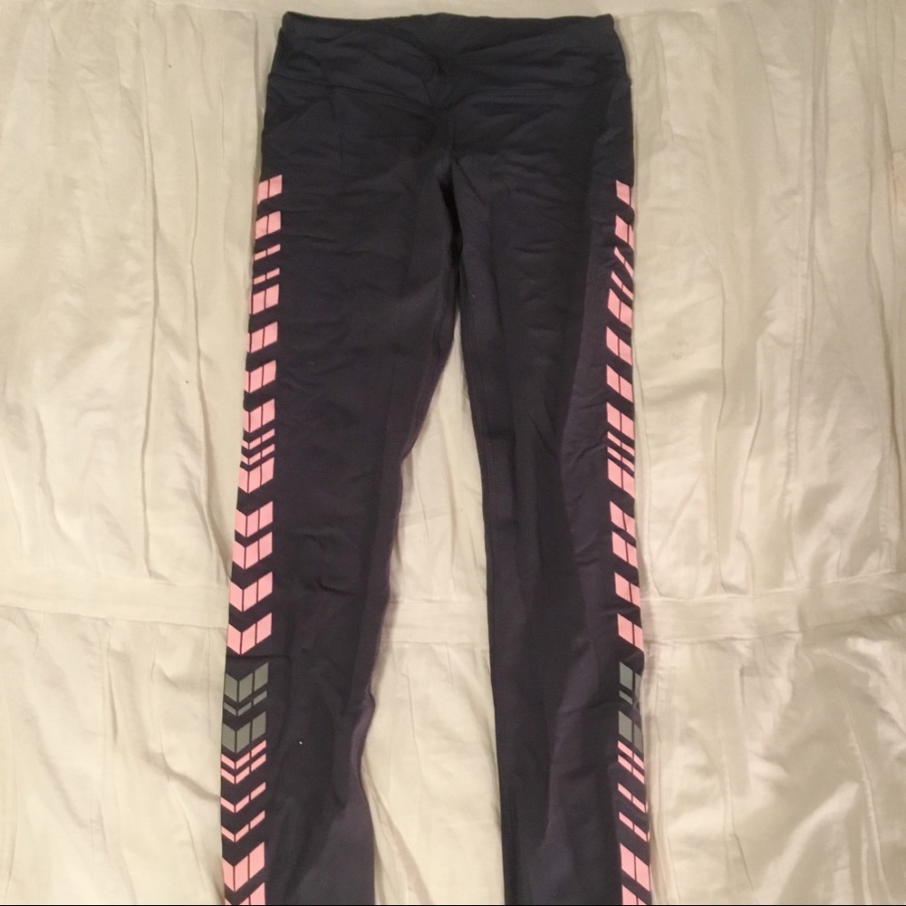 Ivivva purple leggings with pink side stripes